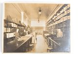 an old photo of a woman in a library