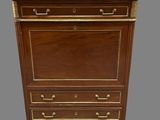 an antique chest of drawers with a marble top