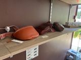 a shelf that has several different bags on it