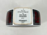 a close up of a bracelet with a label on it