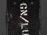 a close up of a metal object with writing on it