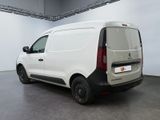 the back of a white van parked inside of a building