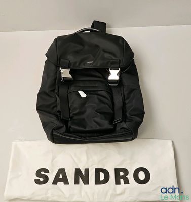 sandro black backpack with white logo on it and a white bag
