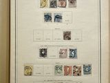 an open book with stamps on it on a table
