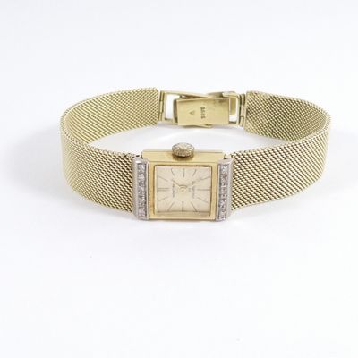 an image of a ladies ' s watch with a mesh bracelet
