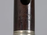 a close up view of a silver and wood object