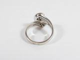 a close up of a silver ring with a flower on it