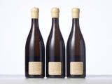 three bottles of wine sitting next to each other on a table