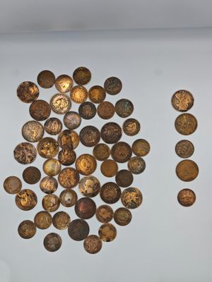 a lot of coins that are on the table
