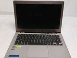 an open laptop computer sitting on top of a white table