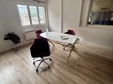 a room with a desk and a chair in it