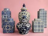 four blue and white vases sitting next to each other