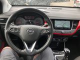 dashboard of a car with a man sitting in the driver ' s seat