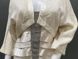an image of a mannequin wearing a dress and jacket