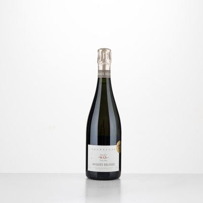 the bottle of wine is sitting on the table with a white background