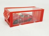 a red toy car inside of a clear box