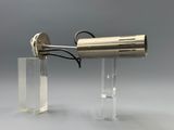 an image of a metal object with a light on it