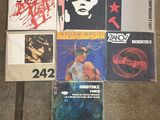 various cd ' s and cassette ' s sitting on the floor