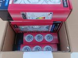 a cardboard box with a dozen of skateboard wheels in it