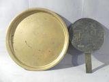 a gold plate and a silver plate next to each other