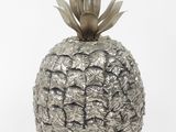 a silver pineapple shaped vase on a white background