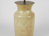 an image of a yellow vase with a light on top of it