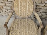 pair of antique carved wood chairs with upholstered arms and arms