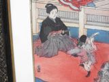 a picture of a woman and a child sitting on a rug