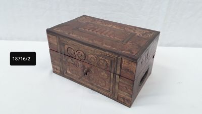 a small wooden box that is sitting on a table