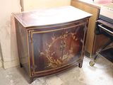 a small cabinet with a floral design on it