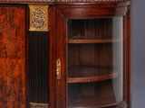 an antique wooden cabinet with marble top and glass doors