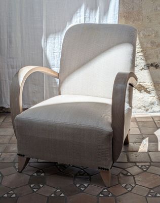 a chair that is sitting in front of a window