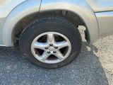 a car that has a flat tire on the road