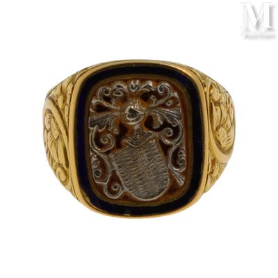 une image représentant une bague dorée et noire ornée d'un lion
