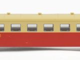 a toy bus that is sitting on a white surface