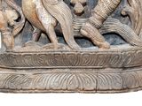 a statue of a man and a woman riding on a horse