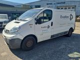 a white van that is parked in front of a building