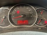 a close up of a speedometer on a car ' s dashboard