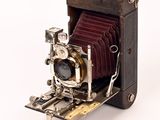 an old camera that is on display on a table