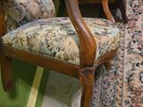 a chair with a teddy bear on it in a room