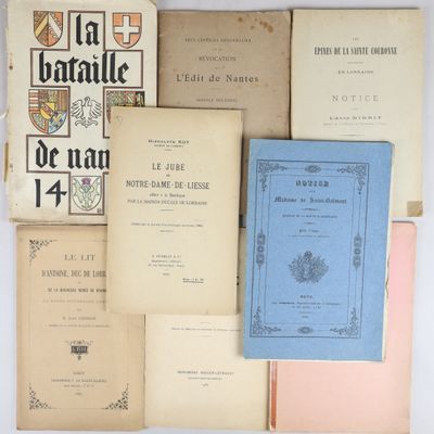 several books are stacked on top of each other on a table