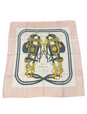 a white and blue square scarf with a gold and black design