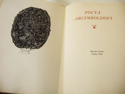 an open book with a drawing of a tree on it