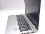 a laptop computer sitting on a white table