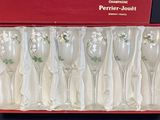 six wine glasses in a red box on a table