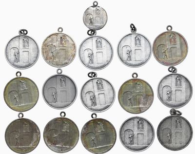 a lot of coins that are on a white surface