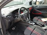 a picture of a car interior with red trims