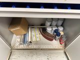 a small cabinet with a lot of items in it