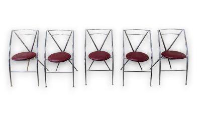 four chairs with red leather seats are lined up against a white background