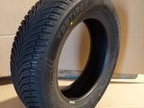 a tire that is sitting on the floor in front of a box